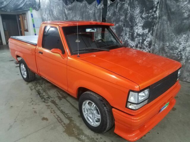 1991 Orange Ford Ranger Pickup Truck