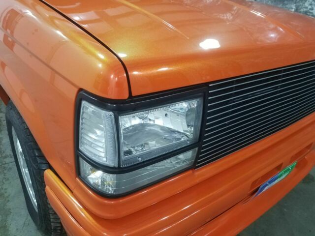 1991 Orange Ford Ranger Pickup Truck