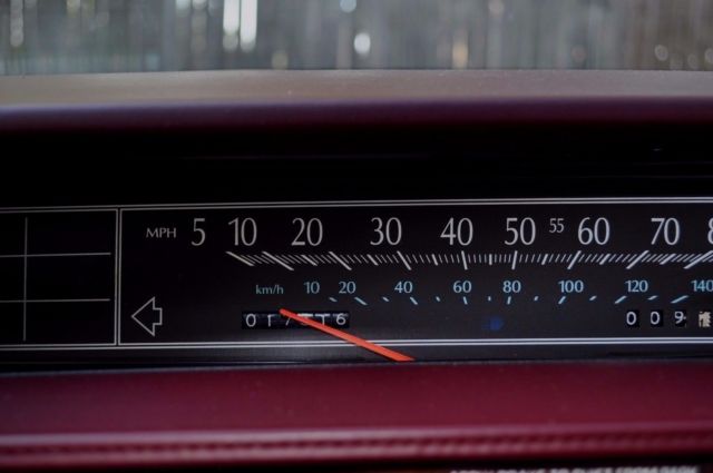 1991 Red Cadillac DeVille Sedan