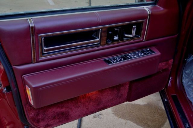 1991 Red Cadillac DeVille Sedan