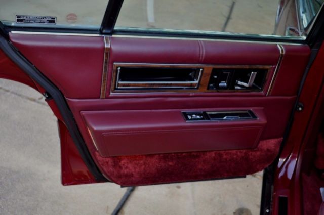 1991 Red Cadillac DeVille Sedan