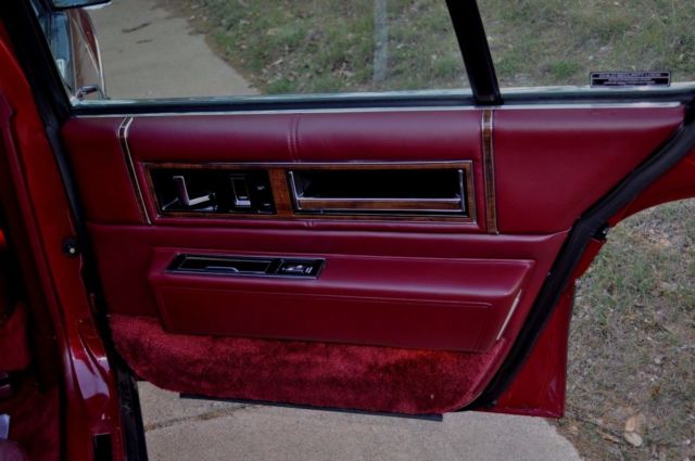 1991 Red Cadillac DeVille Sedan
