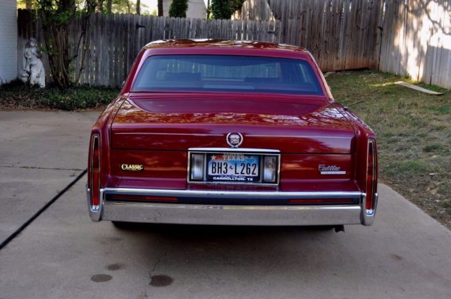 1991 Red Cadillac DeVille Sedan