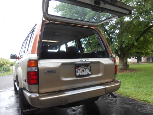 1991 burnt orange/almond Toyota Land Cruiser SUV
