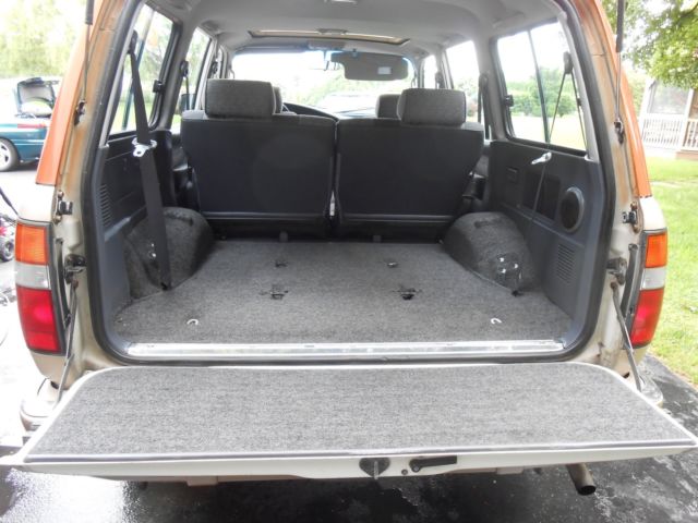 1991 burnt orange/almond Toyota Land Cruiser SUV