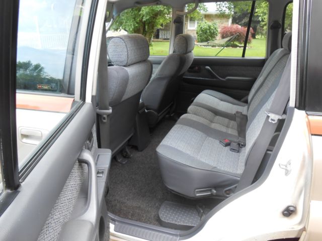 1991 burnt orange/almond Toyota Land Cruiser SUV