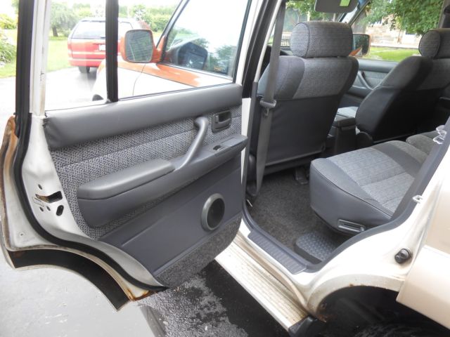 1991 burnt orange/almond Toyota Land Cruiser SUV