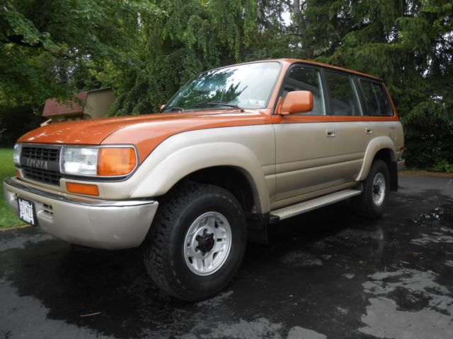 1991 burnt orange/almond Toyota Land Cruiser SUV