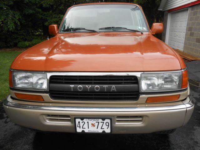 1991 burnt orange/almond Toyota Land Cruiser SUV