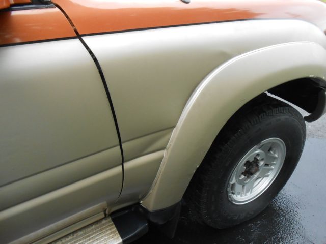 1991 burnt orange/almond Toyota Land Cruiser SUV