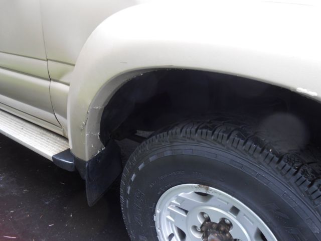 1991 burnt orange/almond Toyota Land Cruiser SUV