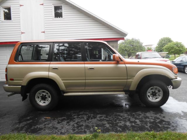 1991 burnt orange/almond Toyota Land Cruiser SUV