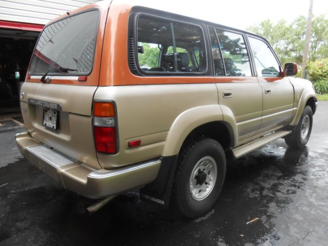 1991 burnt orange/almond Toyota Land Cruiser SUV