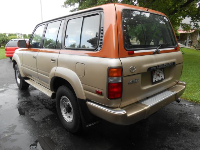 1991 burnt orange/almond Toyota Land Cruiser SUV
