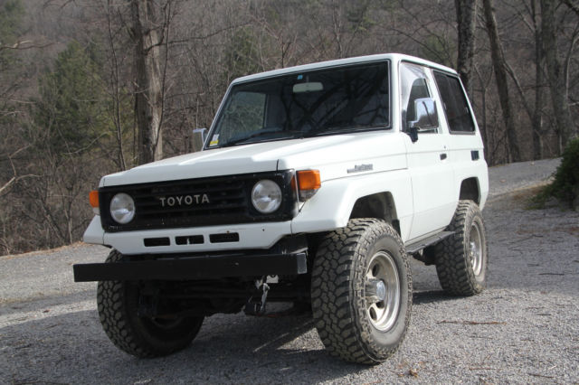 1991 white Toyota Land Cruiser SUV