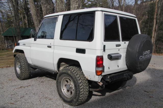 1991 white Toyota Land Cruiser SUV