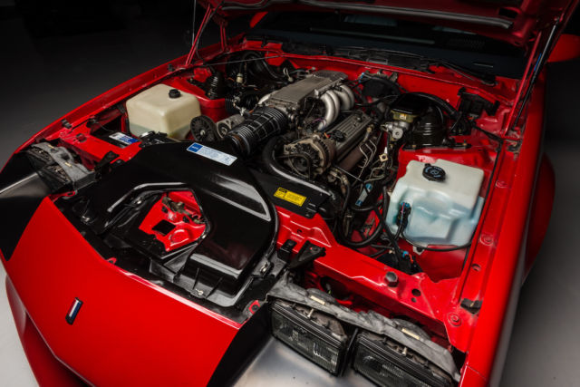 1991 bright red Chevrolet Camaro Coupe
