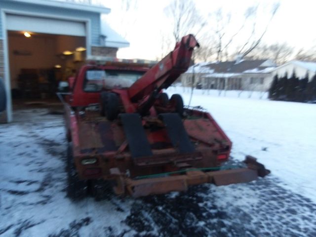 1993 red Ford Tow Truck