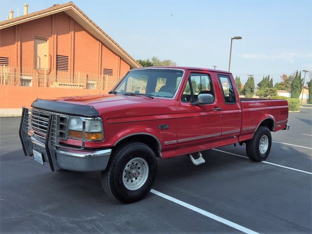 1993 red Ford F-150 Extended Cab Pickup