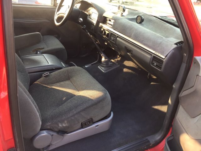 1993 red Ford F-150 Extended Cab Pickup