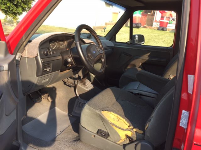1993 red Ford F-150 Extended Cab Pickup