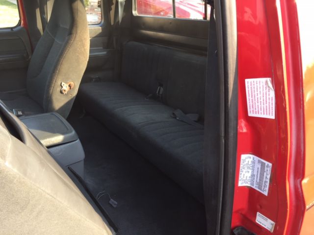 1993 red Ford F-150 Extended Cab Pickup