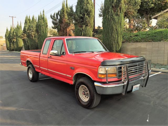 1993 red Ford F-150 Extended Cab Pickup