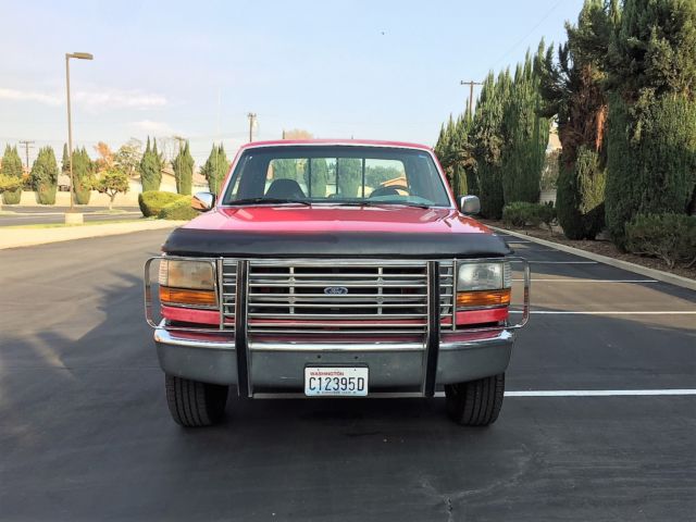 1993 red Ford F-150 Extended Cab Pickup