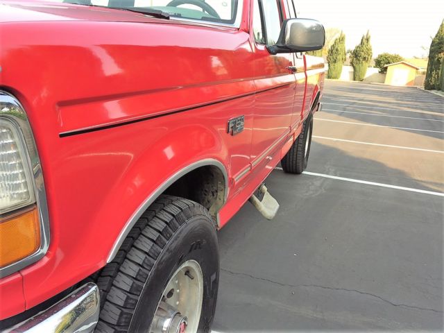 1993 red Ford F-150 Extended Cab Pickup