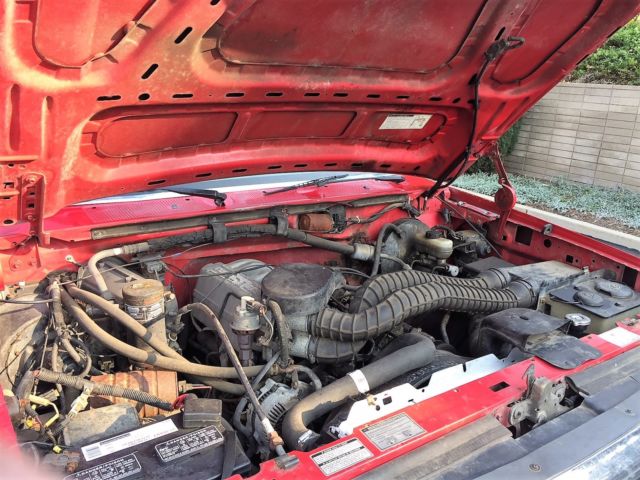 1993 red Ford F-150 Extended Cab Pickup