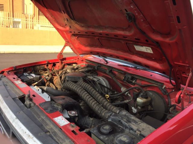 1993 red Ford F-150 Extended Cab Pickup