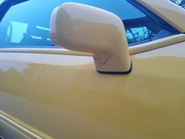 1993 yellow Ford Mustang Convertible