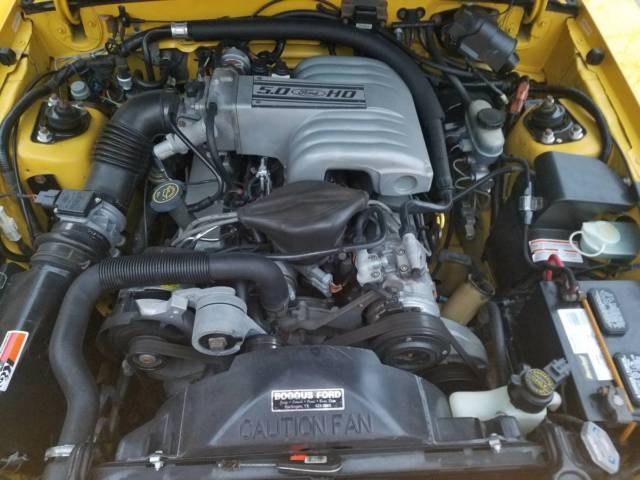 1993 yellow Ford Mustang Convertible