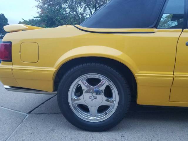 1993 yellow Ford Mustang Convertible