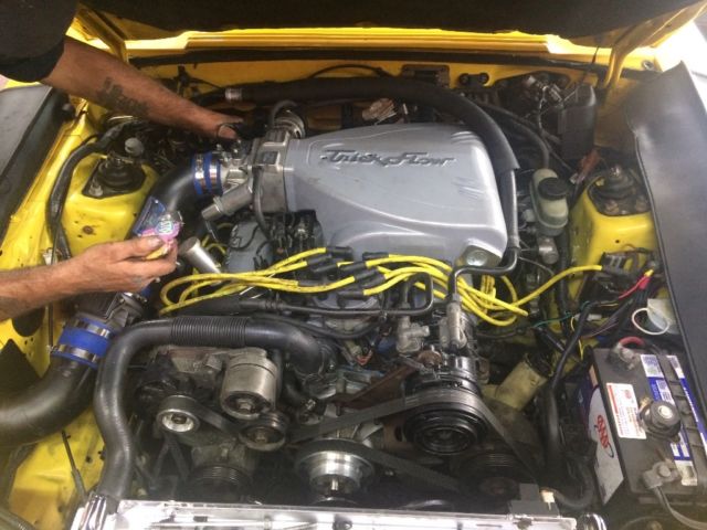 1993 Canary yellow Ford Mustang Convertible