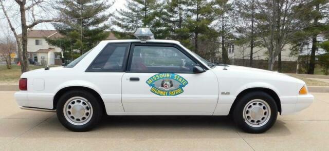 1993 White Ford Mustang --