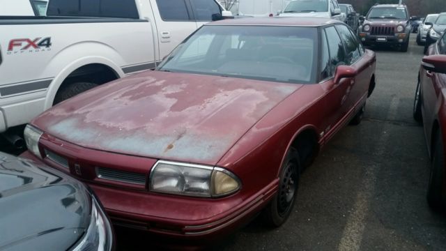 1993 Red Oldsmobile Eighty-Eight Sedan