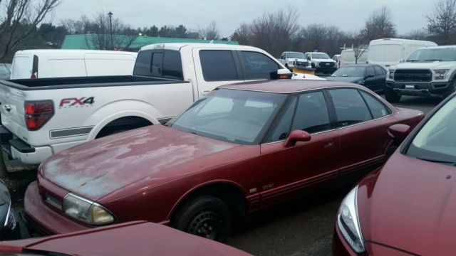 1993 Red Oldsmobile Eighty-Eight Sedan