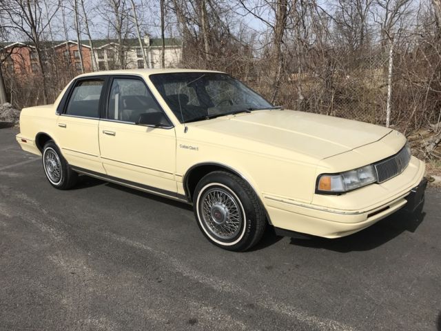 1993 Yellow Oldsmobile Ciera Sedan