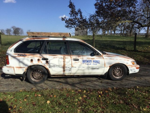 1993 White with rust Toyota Corolla Wagon