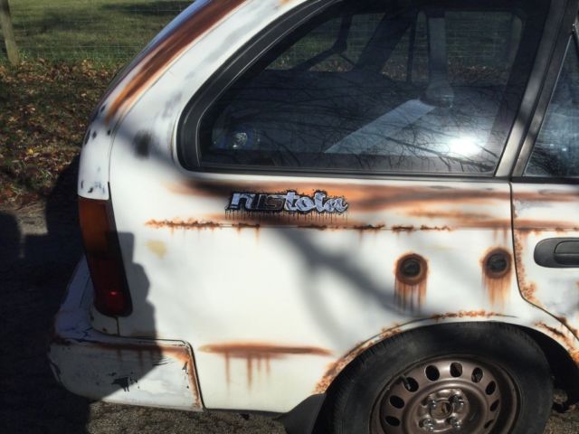 1993 White with rust Toyota Corolla Wagon