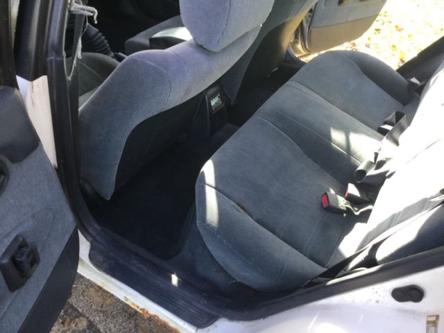 1993 White with rust Toyota Corolla Wagon