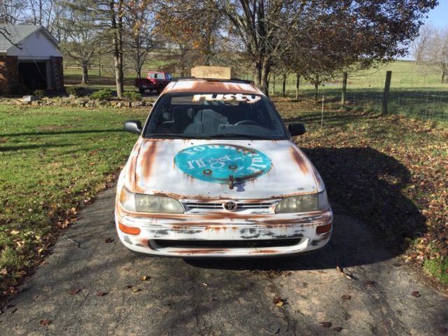 1993 White with rust Toyota Corolla Wagon