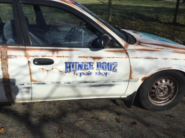 1993 White with rust Toyota Corolla Wagon