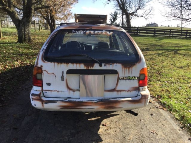 1993 White with rust Toyota Corolla Wagon