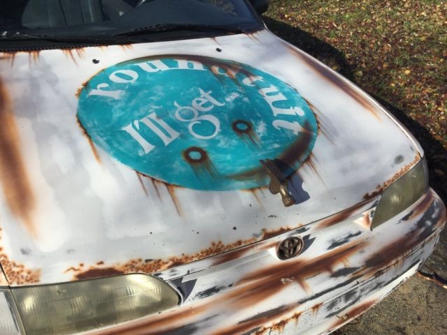 1993 White with rust Toyota Corolla Wagon