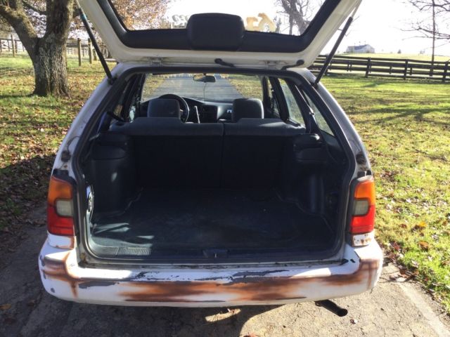 1993 White with rust Toyota Corolla Wagon