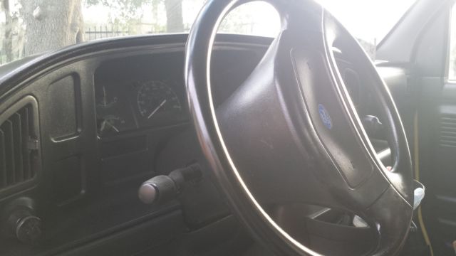 1994 Yellow Ford E-Series Van Box with overhead cabin space