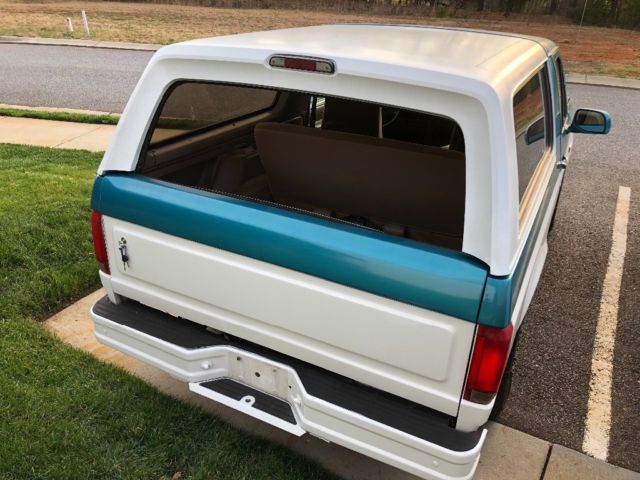 1994 White/ Blue Ford Bronco SUV