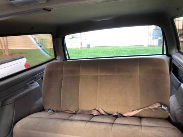 1994 White/ Blue Ford Bronco SUV